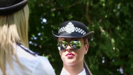 Clothed European police women tug