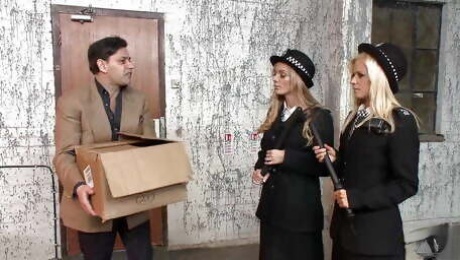 Two blonde milf police officers arrest a guy and take him to the back alley for a threesome